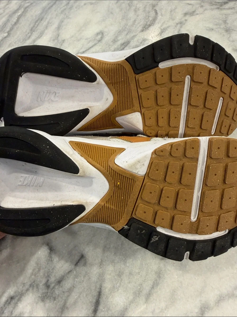 The Nike Tech Hera in Light Orewood